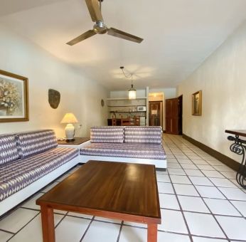 Day use room with lounge area at Puerto De Luna Pet Friendly & Family Suites.