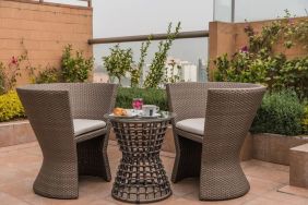 Terrace and seating area at Suites Perisur Furnished Apartments.