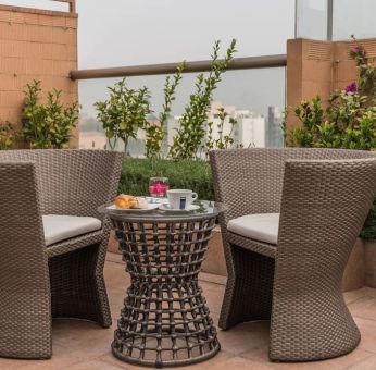 Terrace and seating area at Suites Perisur Furnished Apartments.