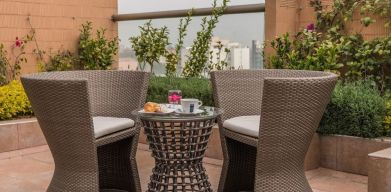 Terrace and seating area at Suites Perisur Furnished Apartments.