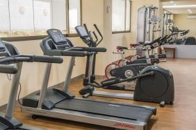 Fitness center at Suites Perisur Furnished Apartments.