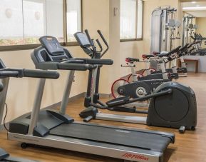 Fitness center at Suites Perisur Furnished Apartments.