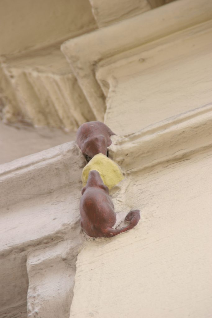 The smallest statue in London, dubbed "Two Mice Eating Cheese," found on the short Philpot Lane in London's historic centre.