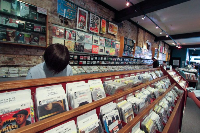 A customer thumbs through myriad vinyl records at Reckless Records in Chicago's Wicker Park neighborhood.